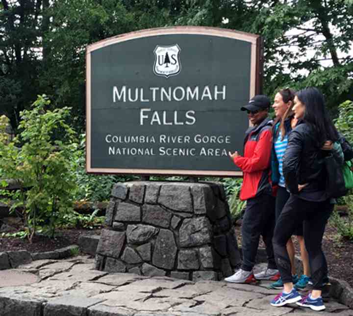 This beautifully designed stone monument sign captures visitors' attention with its sturdy stone base complemented by sand-blasted, hand-painted redwood signage.